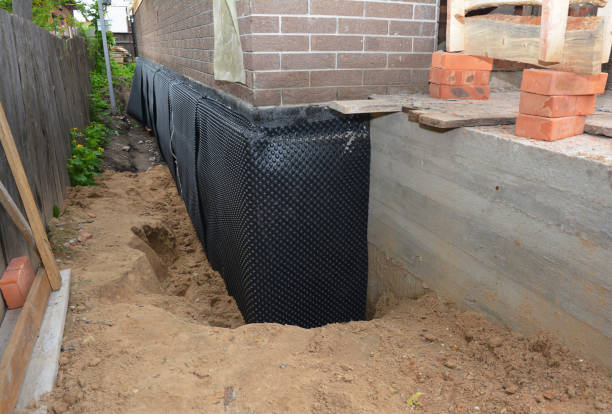 Happy homeowners after waterproofing job in Montello